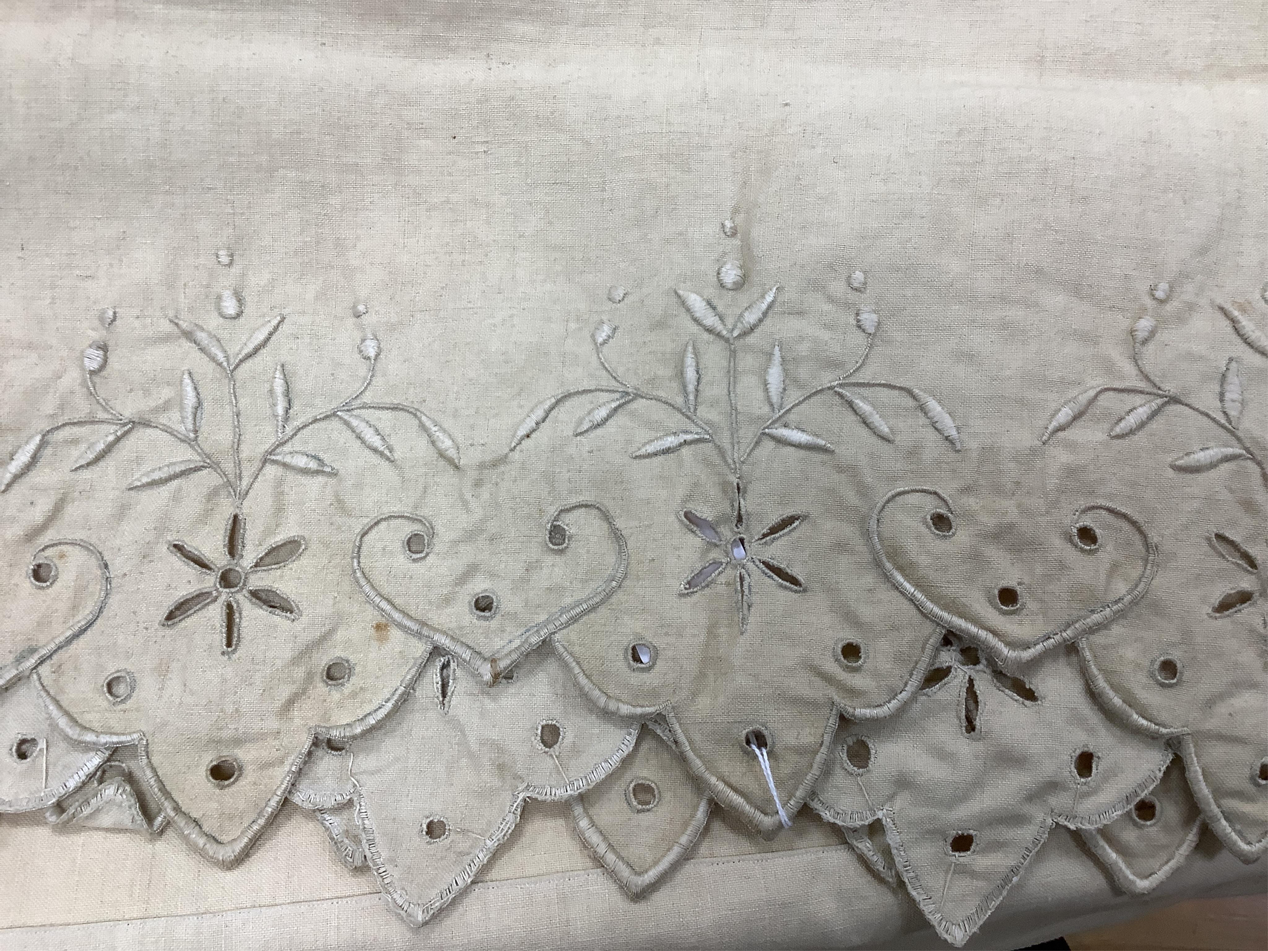 Three French provincial ecru coloured top sheets, with scalloped edged turn backs. One with a deep embroidered turn back, the other two narrower turn backs with cut work and embroidery, one unfinished cut work edge, line